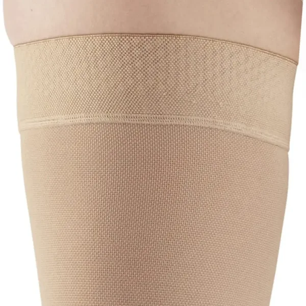These Ames Walker black, open-toe thigh-high compression stockings provide 20-30 mmHg firm graduated support to relieve tired, aching legs and reduce mild varicosities, featuring a stay-up top band and made in the USA.