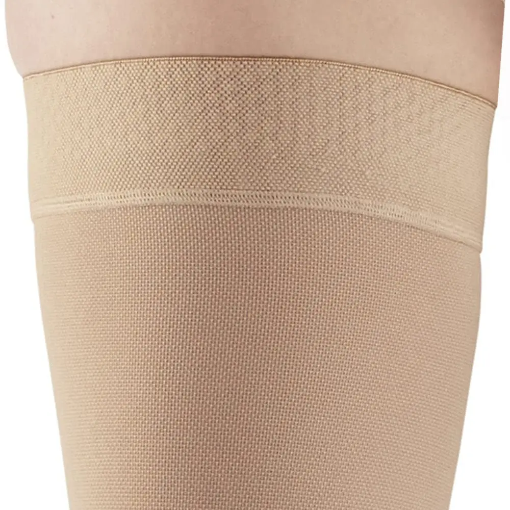 These Ames Walker black, open-toe thigh-high compression stockings provide 20-30 mmHg firm graduated support to relieve tired, aching legs and reduce mild varicosities, featuring a stay-up top band and made in the USA.