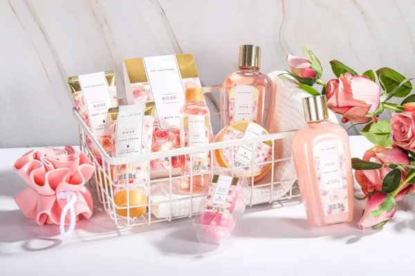This 10-piece rose-scented spa gift set for women includes bath bombs, body lotion, and a tote bag, perfect as a birthday or Mother's Day gift for relaxation and skin nourishment.