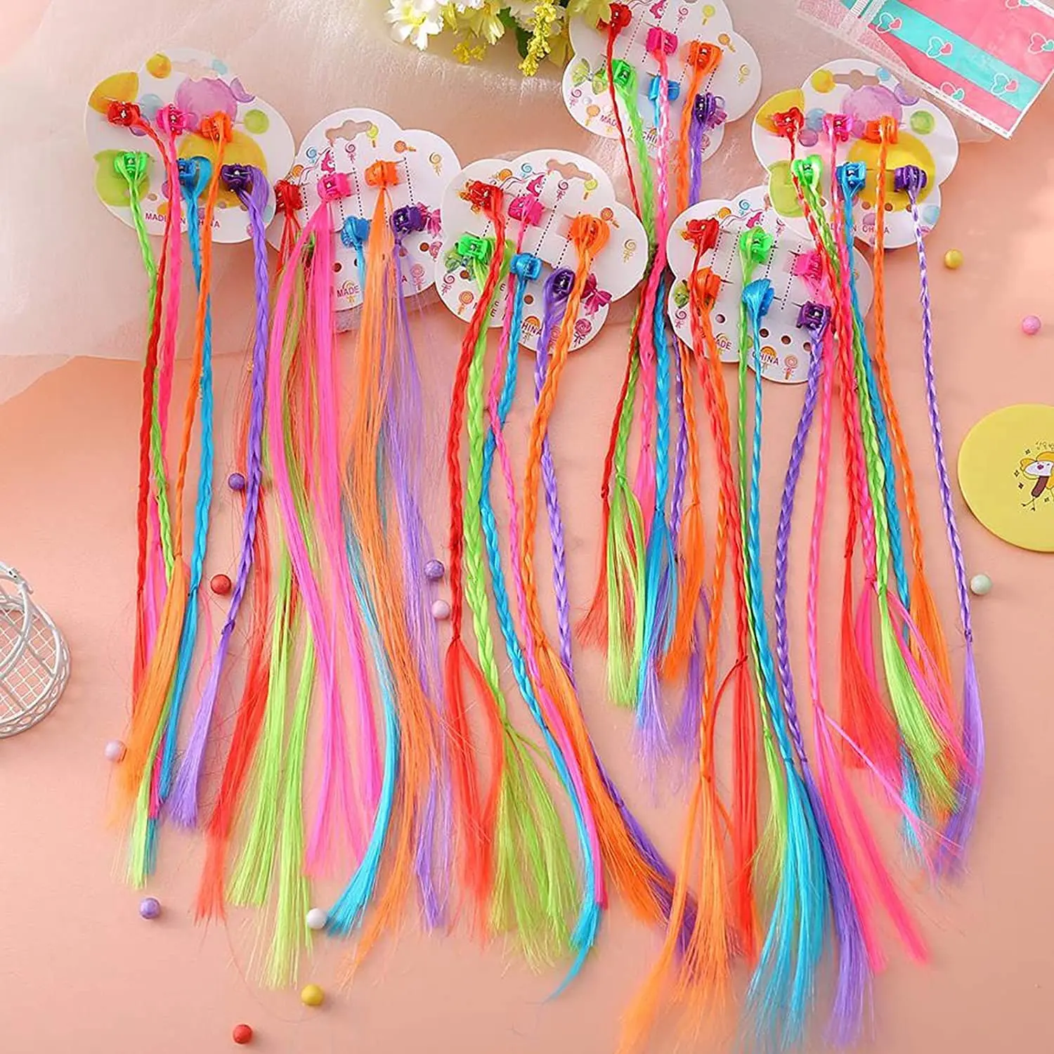 These colorful clip-in hair extensions for girls are made of high-quality nylon and feature secure clips for easy attachment, perfect for adding a fun, vibrant touch to any hairstyle at parties, birthdays, and everyday wear.