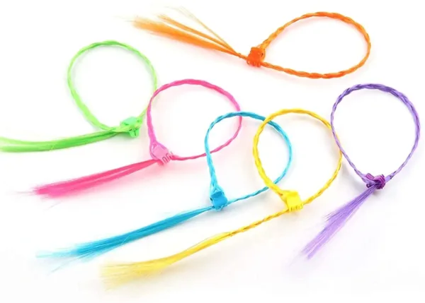 These colorful clip-in hair extensions for girls are made of high-quality nylon and feature secure clips for easy attachment, perfect for adding a fun, vibrant touch to any hairstyle at parties, birthdays, and everyday wear.