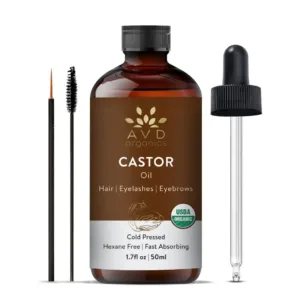 A bottle of AVD Organics Jamaican Black Castor Oil with dropper and lash brush, for moisturizing hair and skin and promoting eyelash and eyebrow growth.