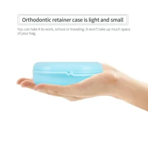 A bluish orthodontic retainer case with vent holes is lightweight, portable, and perfect for storing aligners, mouthguards, or dentures at home, the office, or while traveling.